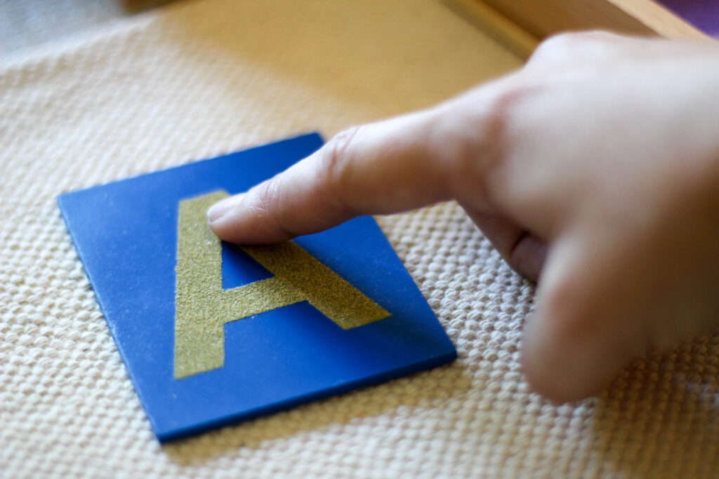 Diy Montessori Sand Writing Tray With Free Printable Letter With Letter Tracing In Sand