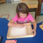 Tracing The Sandpaper Letter And Drawing It In Sand Tray Regarding Letter Tracing In Sand